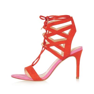 Bright orange caged lace-up heels